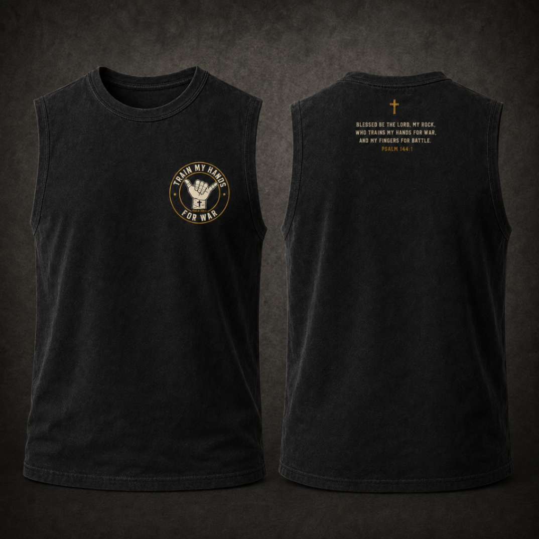 Product mockup: front and back of a washed-black sleeveless cotton training shirt — circular bone-and-gold TMHFW shaka crest centered on the chest, Psalm 144:1 printed in condensed type across the upper back